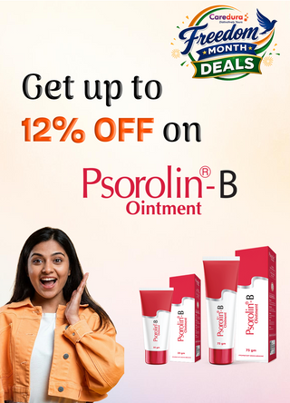 Promotional ad for Caredura Freedom Month Deals featuring Psorolin-B Ointment. The graphic includes a smiling woman in an orange jacket on the left, several tubes and boxes of Psorolin-B ointment on the bottom right, and large text reading, 'Get up to 12% OFF on Psorolin-B Ointment, which is know as the best ointment for psoriasis in India.' 